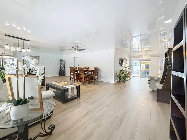 a dining room with furniture and wooden floor