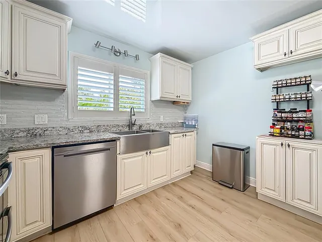 a bathroom with a shower a toilet and a sink