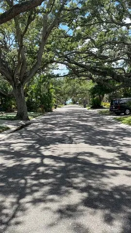 a living room with furniture a dining table and wooden floor