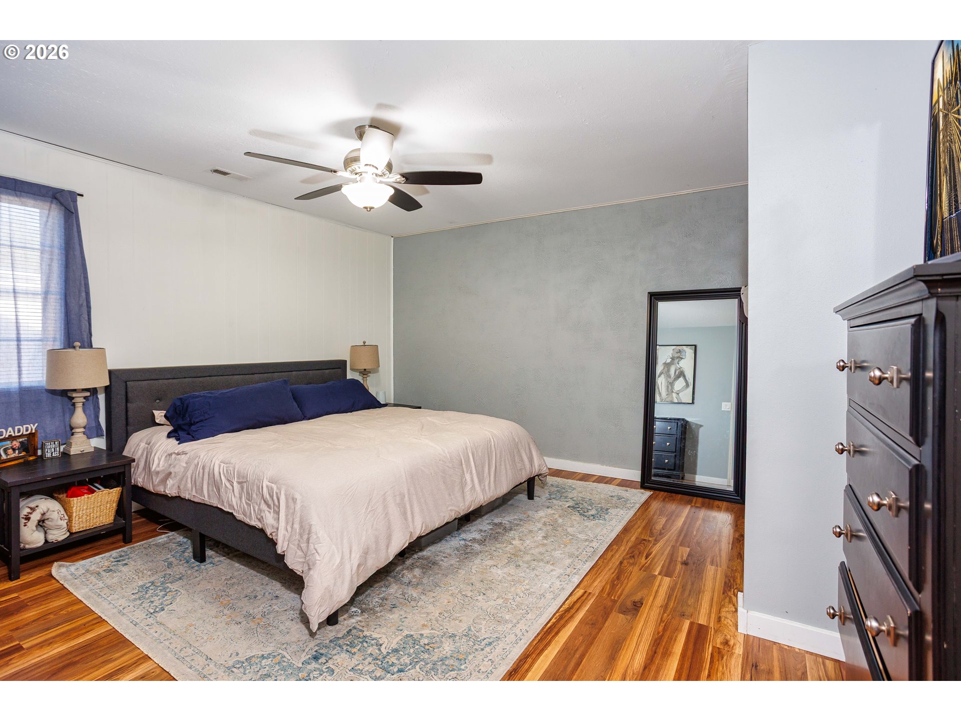 85 Northeast 23rd Street Gresham, OR 97030 - Photo 13 of 23 a bedroom with a bed and a chandelier