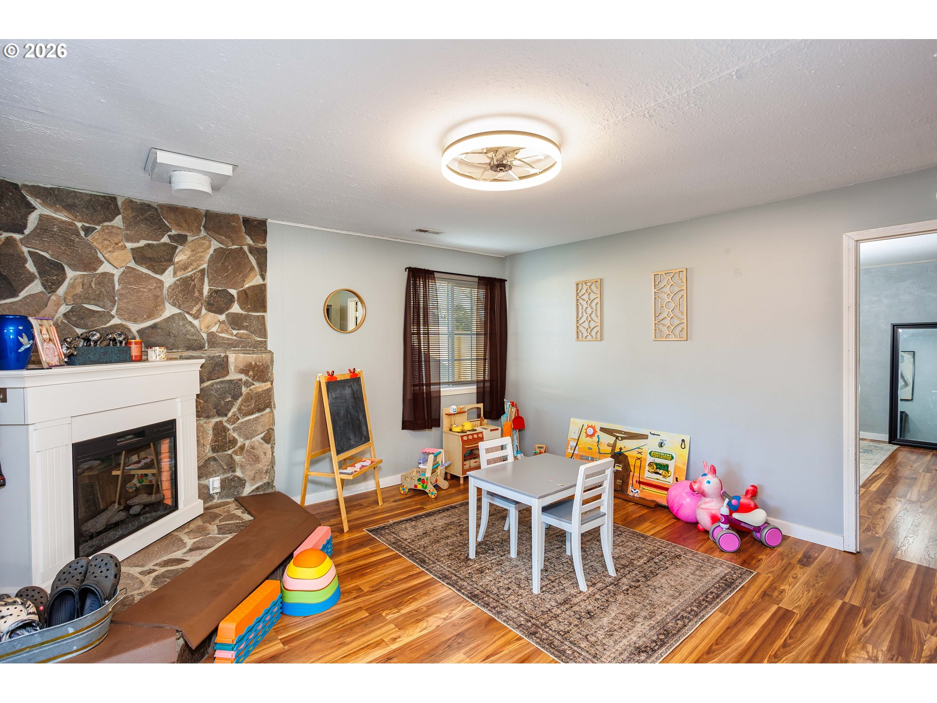 85 Northeast 23rd Street Gresham, OR 97030 - Photo 10 of 23 a living room with furniture and a fireplace