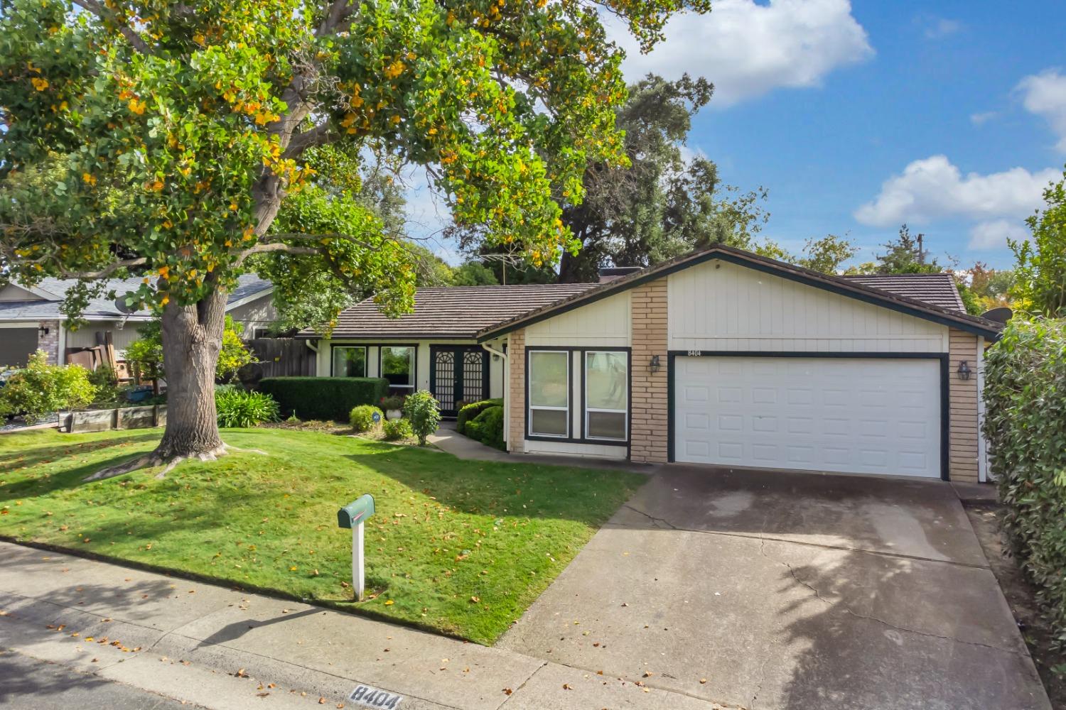 8404 Gaylor Way Carmichael, CA 95608 - Photo 1 of 1 a front view of a house with a yard and garage