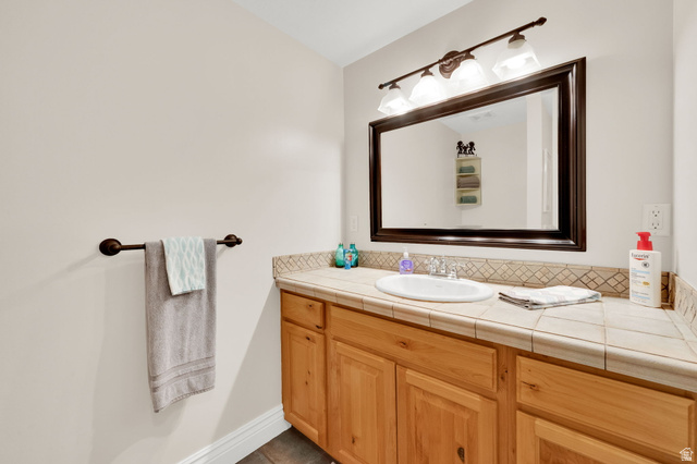 1506 Lakeview Drive Bountiful, UT 84010 - Photo 26 of 58 Bathroom featuring vanity and baseboards