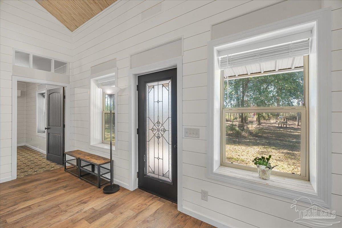 1660 Annie Penton Road Jay, FL 32565 - Photo 11 of 56 a view of a room with wooden floor and windows