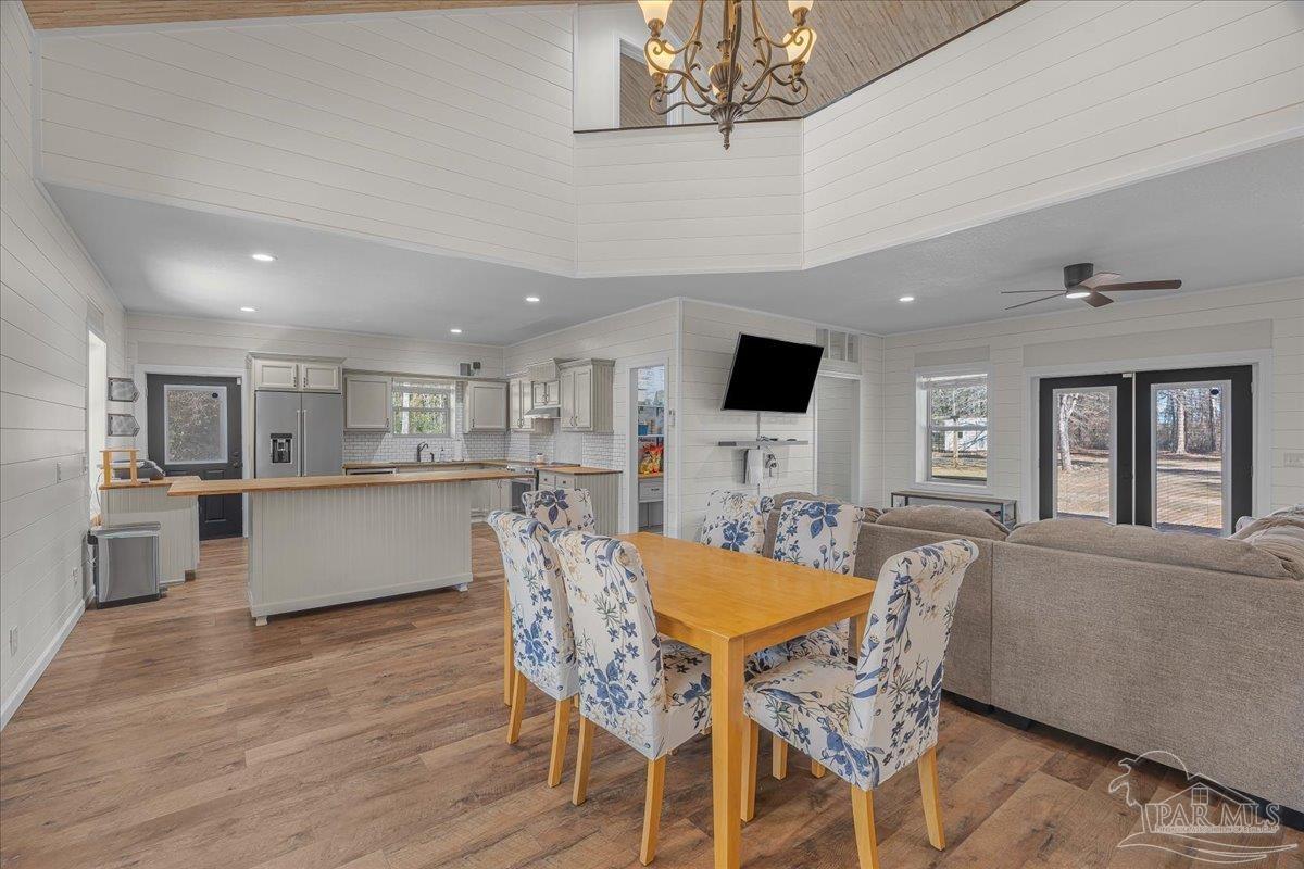 1660 Annie Penton Road Jay, FL 32565 - Photo 14 of 56 a view of a dining room with furniture a kitchen and chandelier