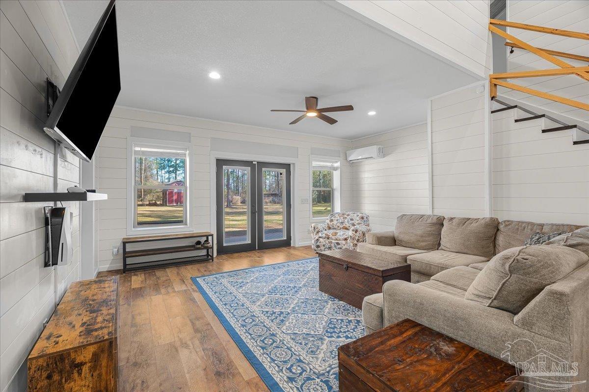 1660 Annie Penton Road Jay, FL 32565 - Photo 15 of 56 a living room with furniture and a flat screen tv