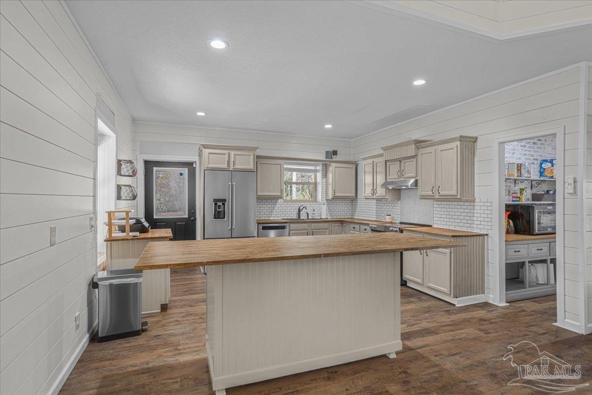1660 Annie Penton Road Jay, FL 32565 - Photo 18 of 56 a large kitchen with kitchen island a sink a center island stainless steel appliances and a cabinets