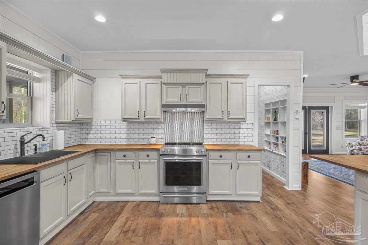 1660 Annie Penton Road Jay, FL 32565 - Photo 19 of 56 a kitchen with a sink stove and cabinets