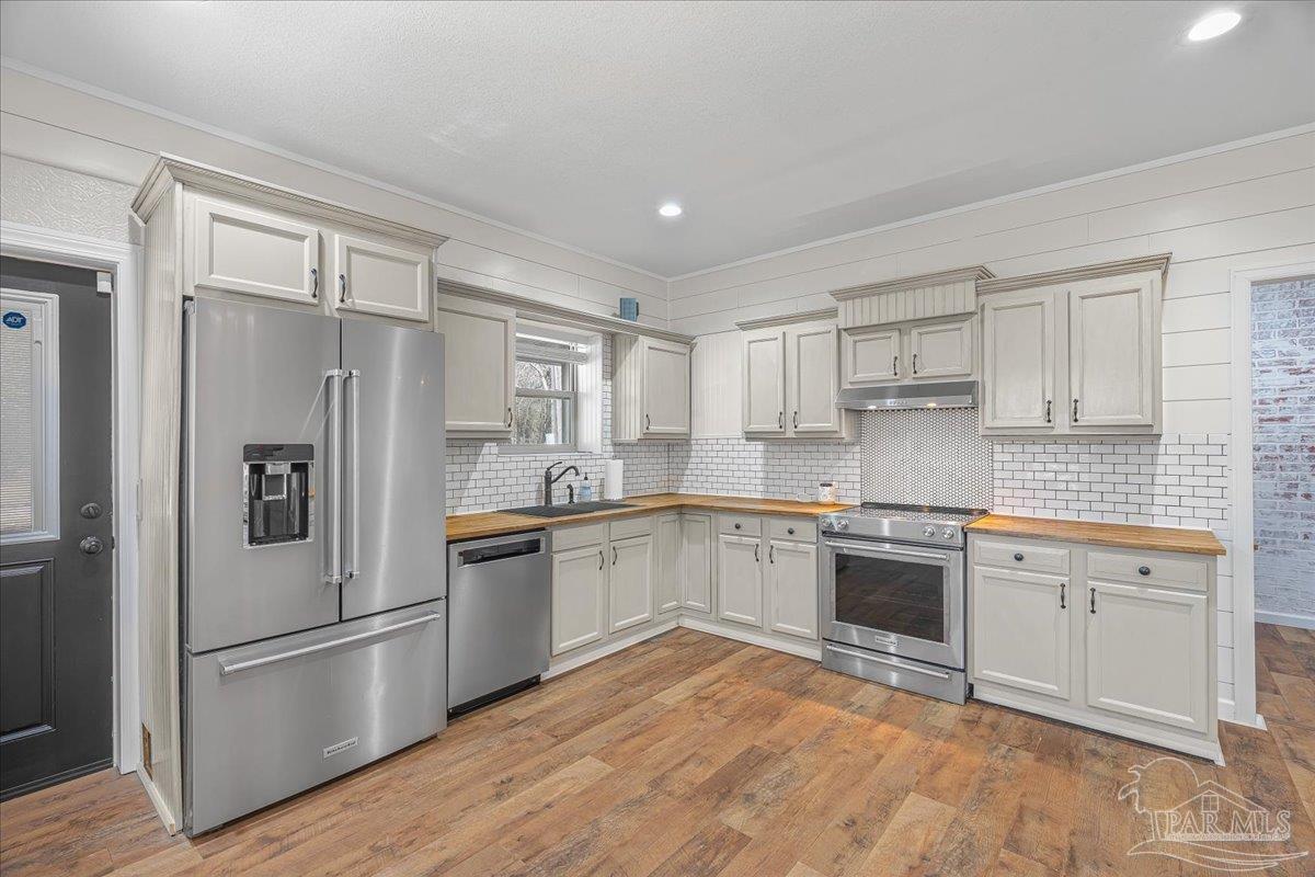 1660 Annie Penton Road Jay, FL 32565 - Photo 21 of 56 a kitchen with stainless steel appliances granite countertop a refrigerator sink and stove