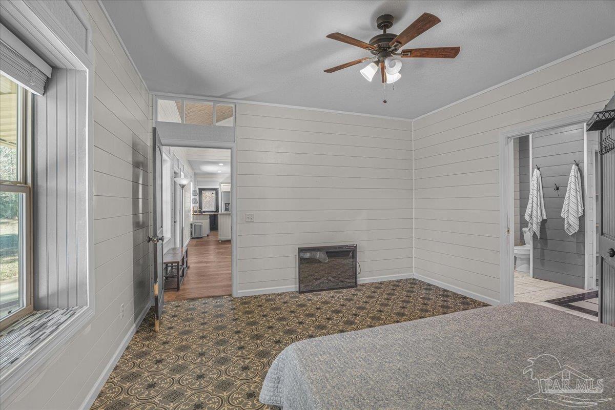 1660 Annie Penton Road Jay, FL 32565 - Photo 29 of 56 a bedroom with a bed and a flat screen tv