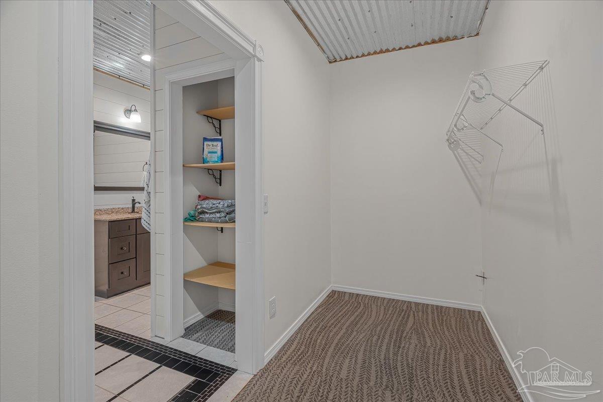 1660 Annie Penton Road Jay, FL 32565 - Photo 33 of 56 a view of a hallway with wooden floor and a cabinet