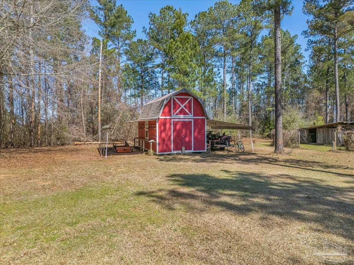 1660 Annie Penton Road Jay, FL 32565 - Photo 47 of 56 a view of outdoor space with trees