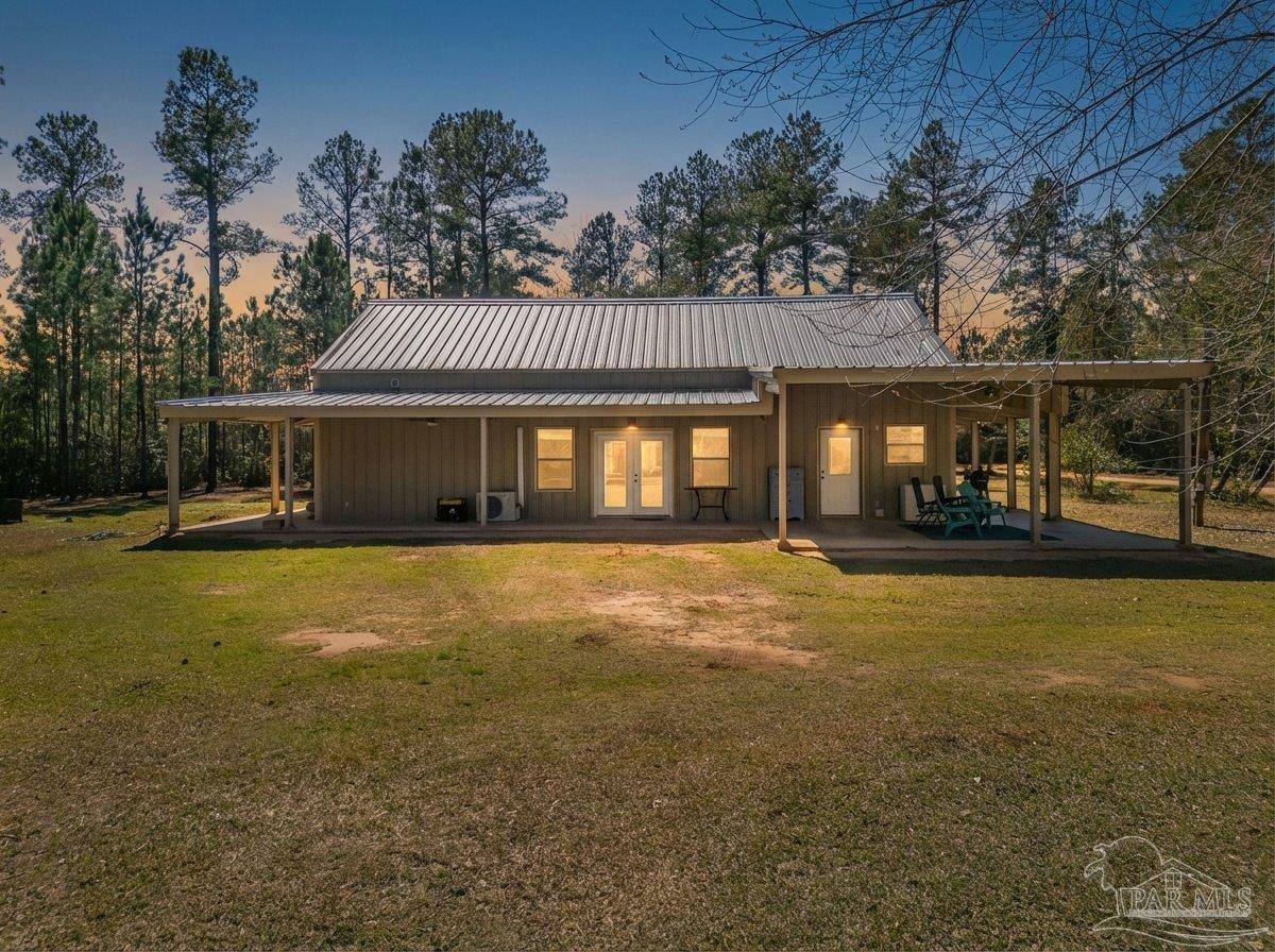 1660 Annie Penton Road Jay, FL 32565 - Photo 9 of 56 a front view of a house with a garden