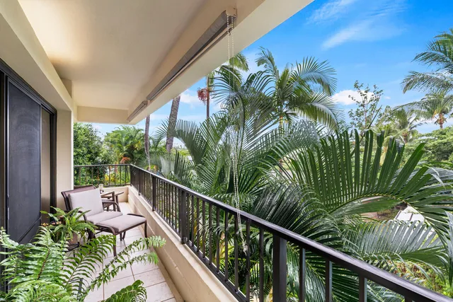 a view of a balcony with chairs