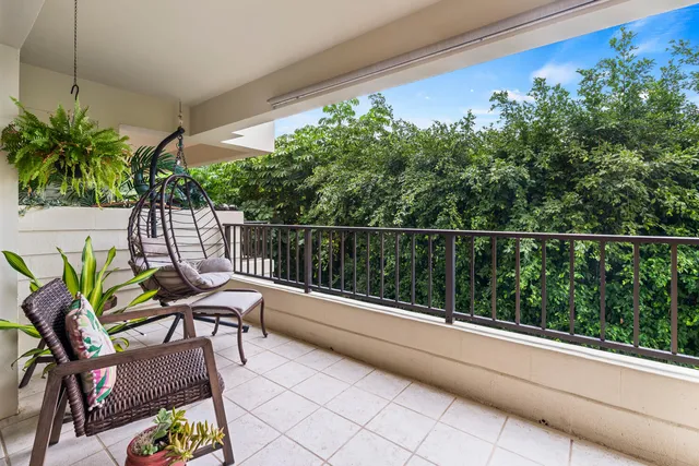 a view of balcony with furniture