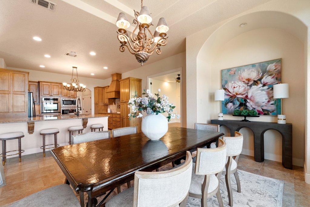 143 Champion Way Spring Branch, TX 78070 - Photo 11 of 40 a view of a dining room with furniture and chandelier