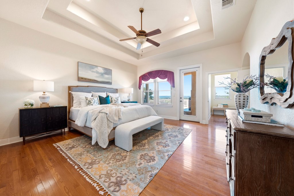 143 Champion Way Spring Branch, TX 78070 - Photo 12 of 40 a bed room with a bed and a television