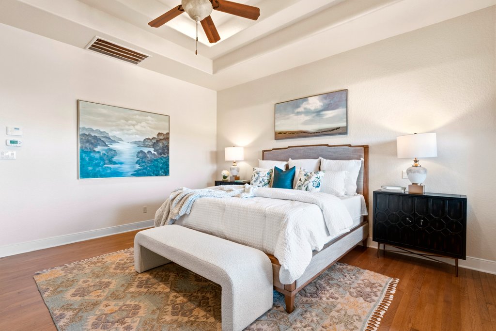 143 Champion Way Spring Branch, TX 78070 - Photo 14 of 40 a bedroom with a bed and a painting on the wall