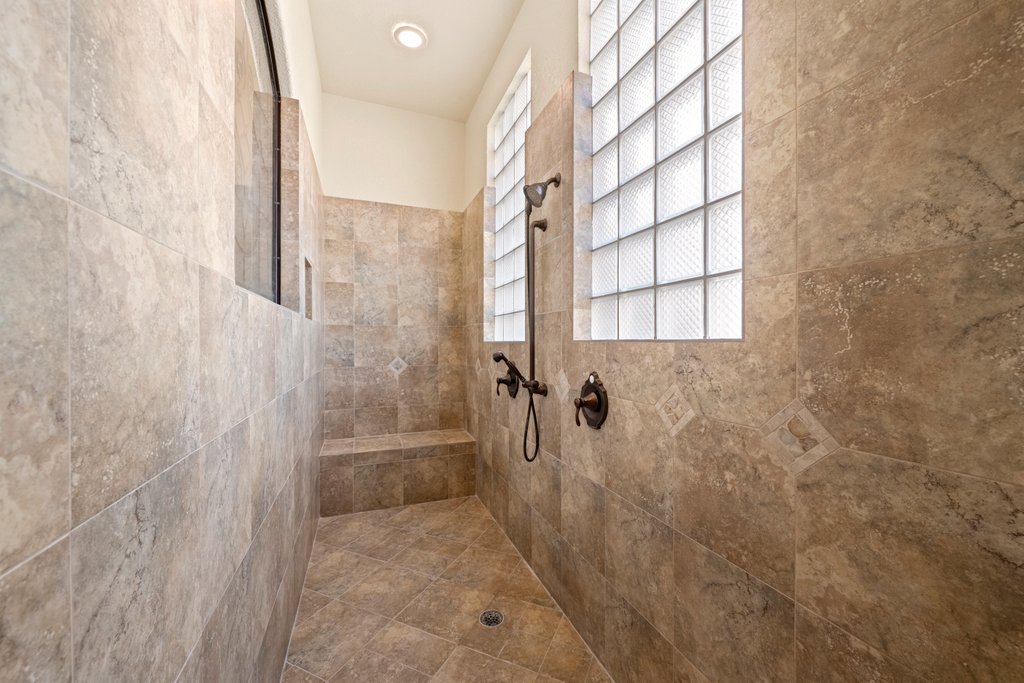 143 Champion Way Spring Branch, TX 78070 - Photo 16 of 40 a bathroom with a shower
