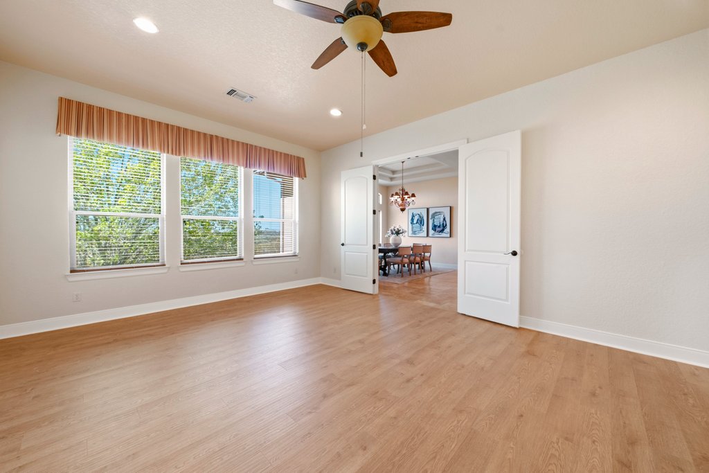 143 Champion Way Spring Branch, TX 78070 - Photo 21 of 40 a view of a livingroom with a ceiling fan and window