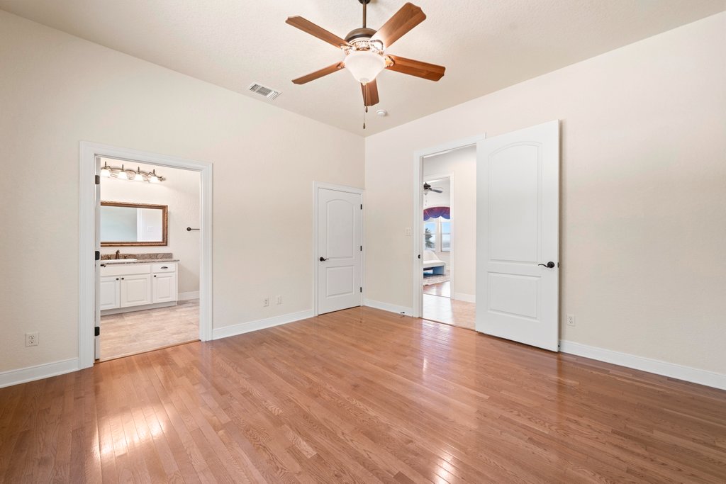 143 Champion Way Spring Branch, TX 78070 - Photo 26 of 40 wooden floor in an empty room