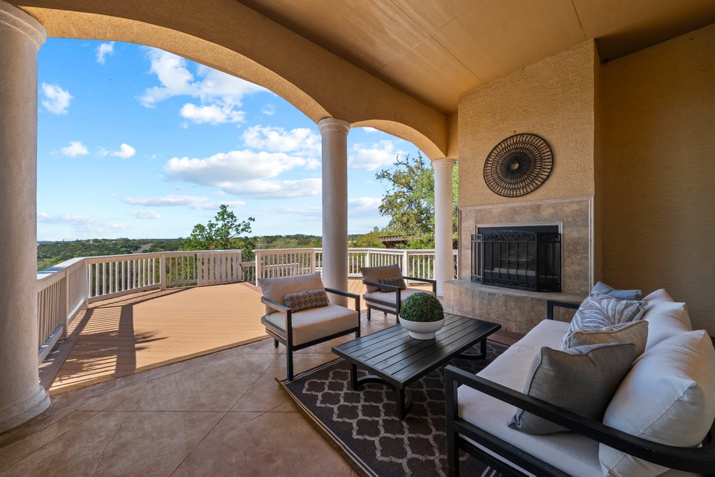 143 Champion Way Spring Branch, TX 78070 - Photo 29 of 40 a living room with furniture and a fireplace