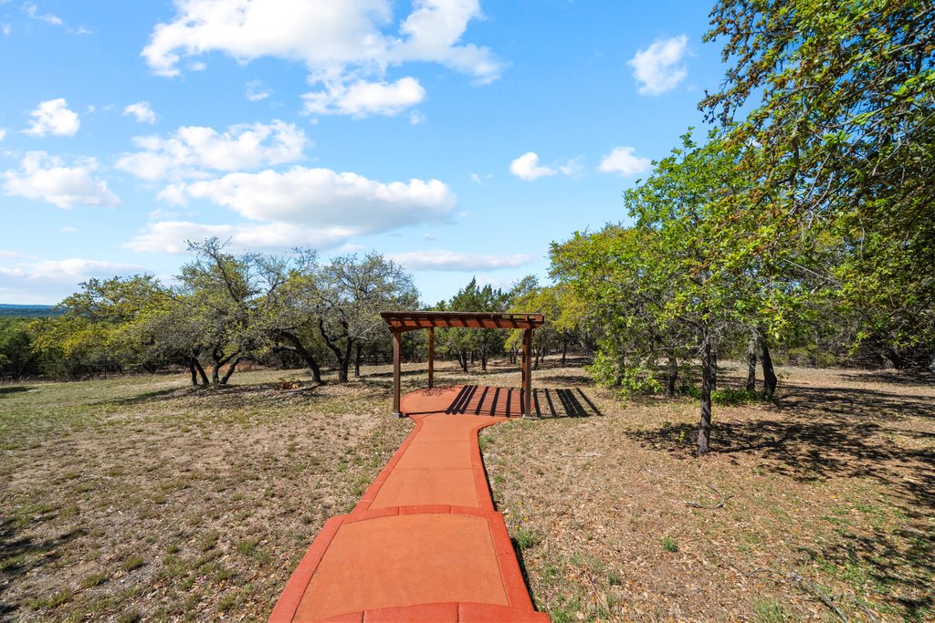 143 Champion Way Spring Branch, TX 78070 - Photo 32 of 40 a view of a swimming pool with a patio