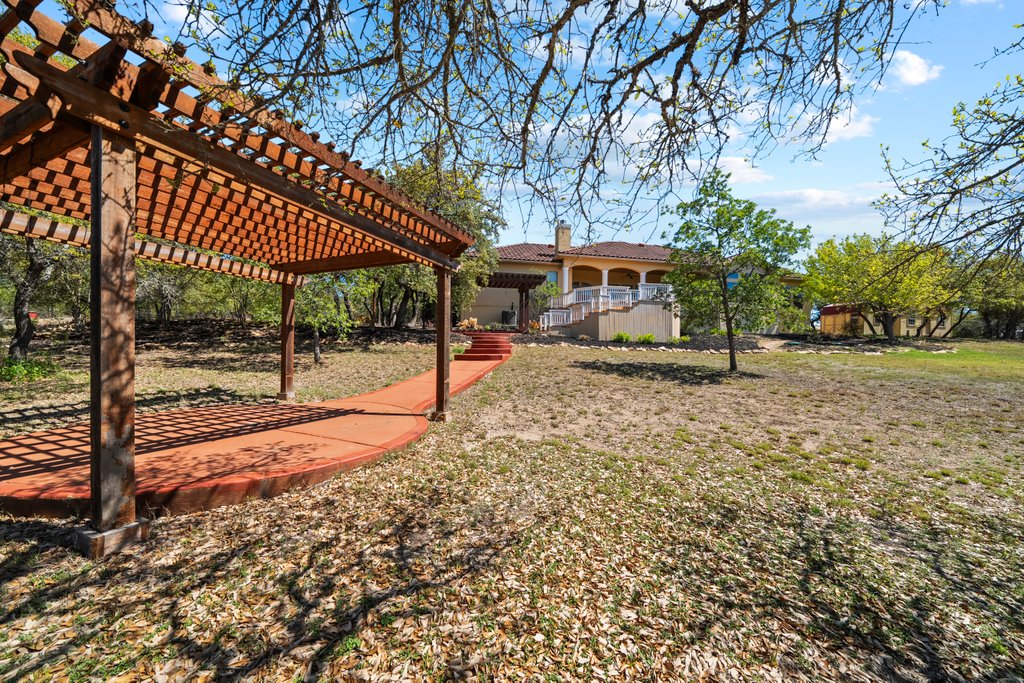 143 Champion Way Spring Branch, TX 78070 - Photo 33 of 40 a view of a house with a yard porch and sitting area