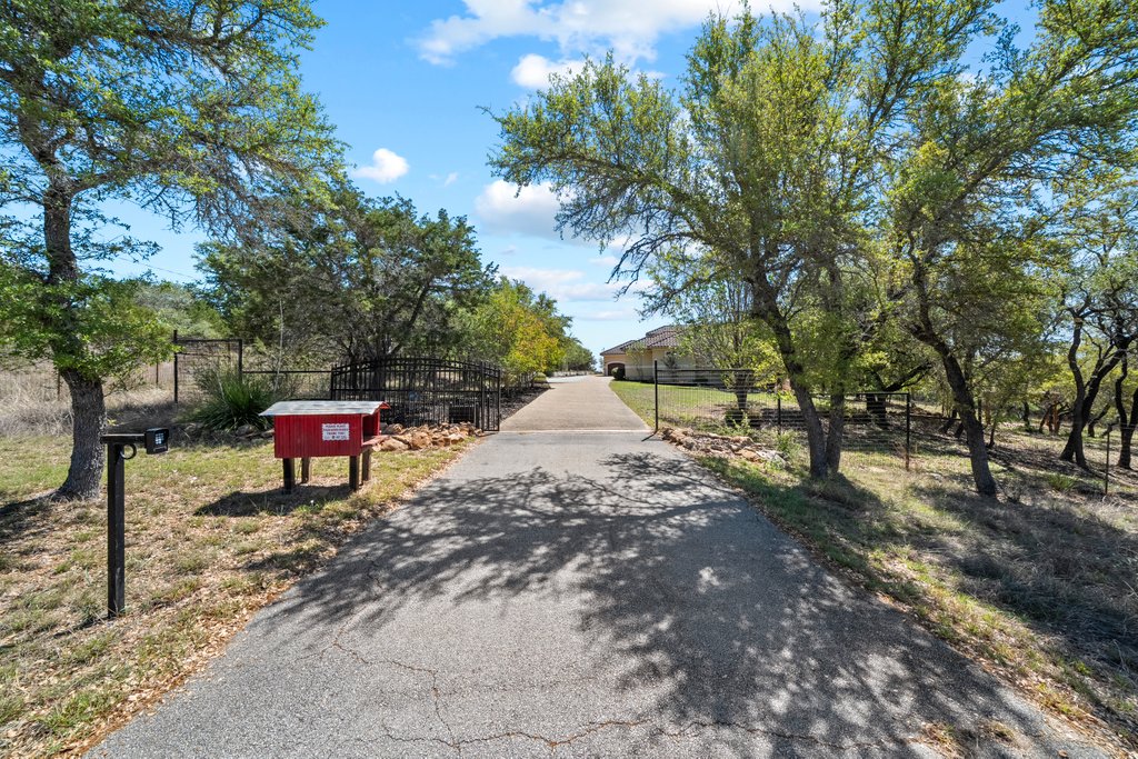 143 Champion Way Spring Branch, TX 78070 - Photo 37 of 40 a backyard of a house with table and chairs