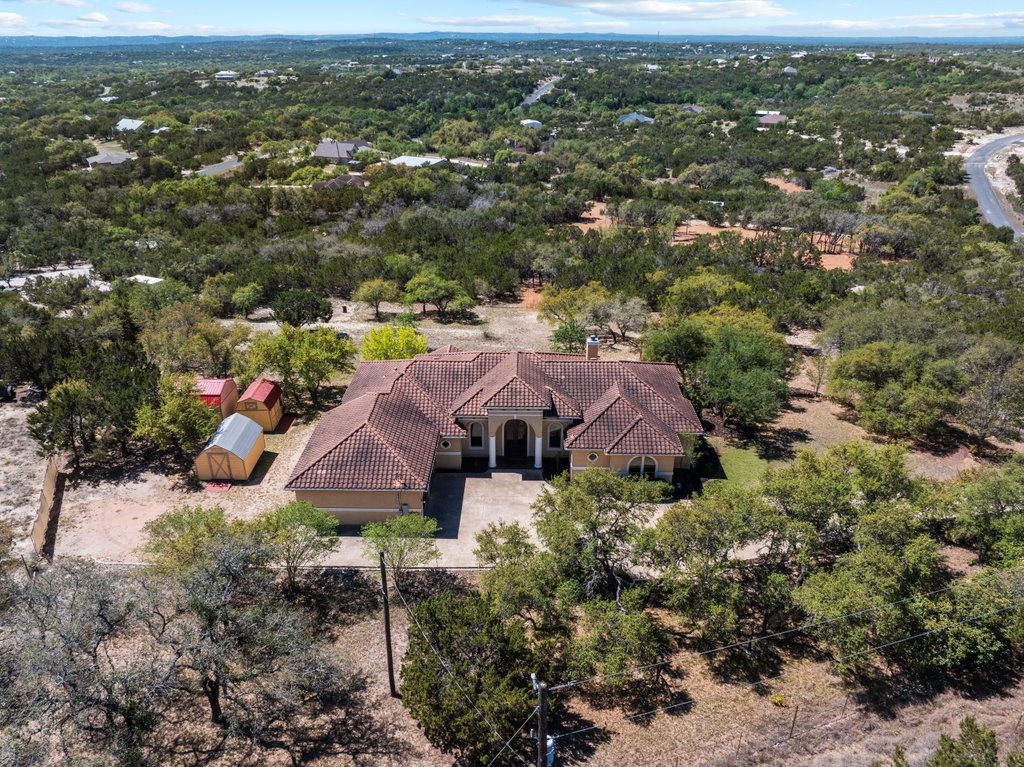 143 Champion Way Spring Branch, TX 78070 - Photo 39 of 40 an aerial view of house with yard and mountain view in back