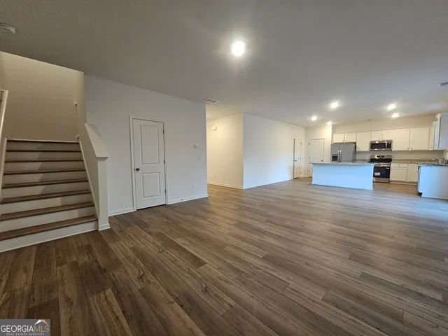 a view of a livingroom with wooden floor