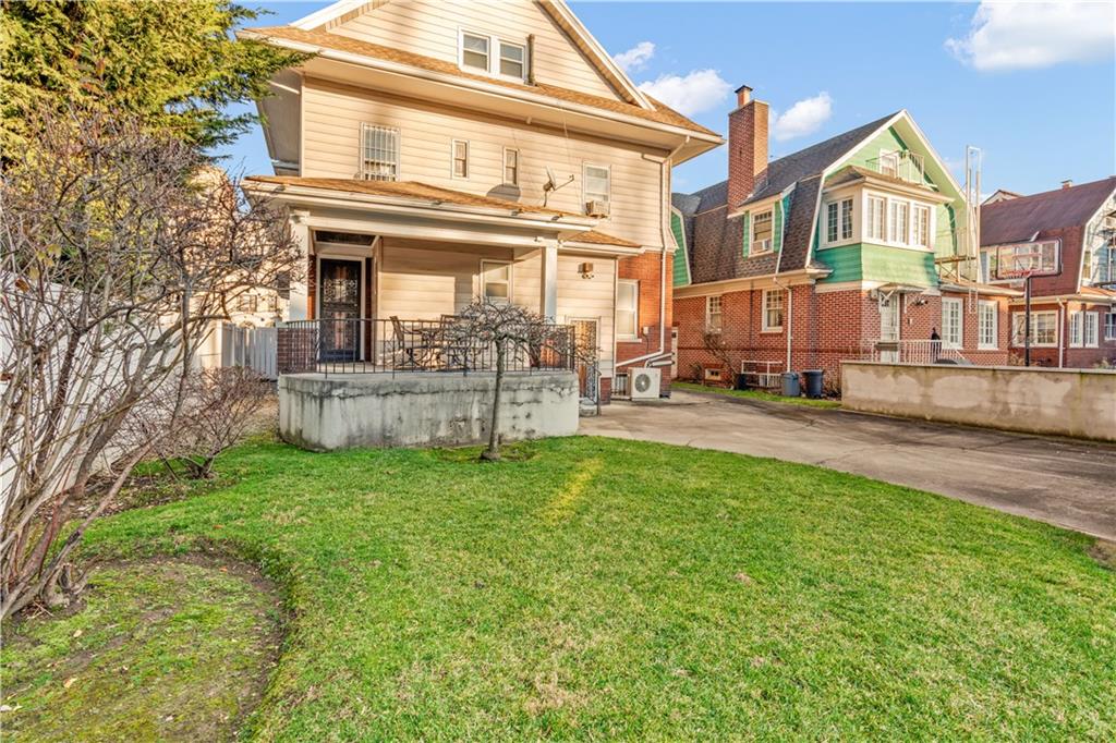 976 Ocean Avenue Brooklyn, NY 11226 - Photo 11 of 24 front view of a house with a yard