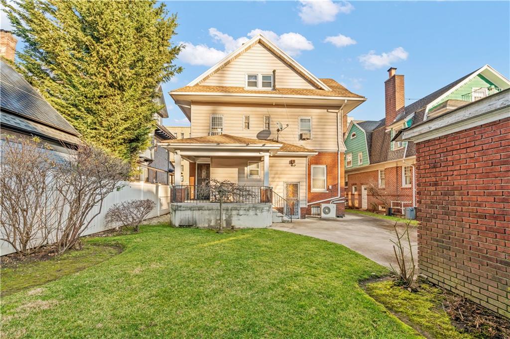 976 Ocean Avenue Brooklyn, NY 11226 - Photo 10 of 24 a front view of a house with garden