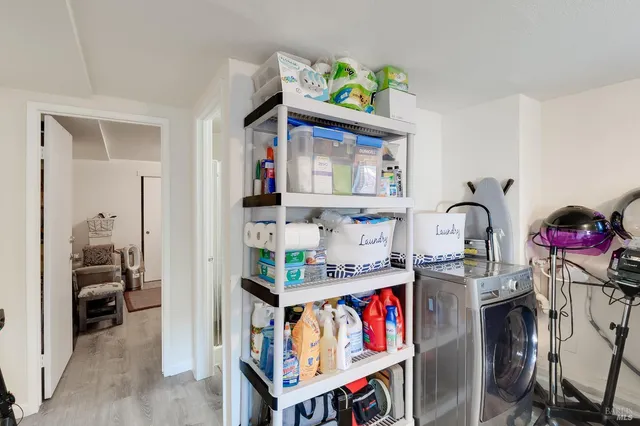 a view of a closet with storage and utility room