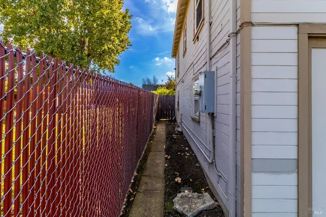 a view of a pathway with a backyard of the house