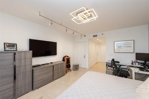 a bathroom with a tub and shower