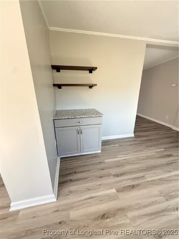 a view of an empty room and a window