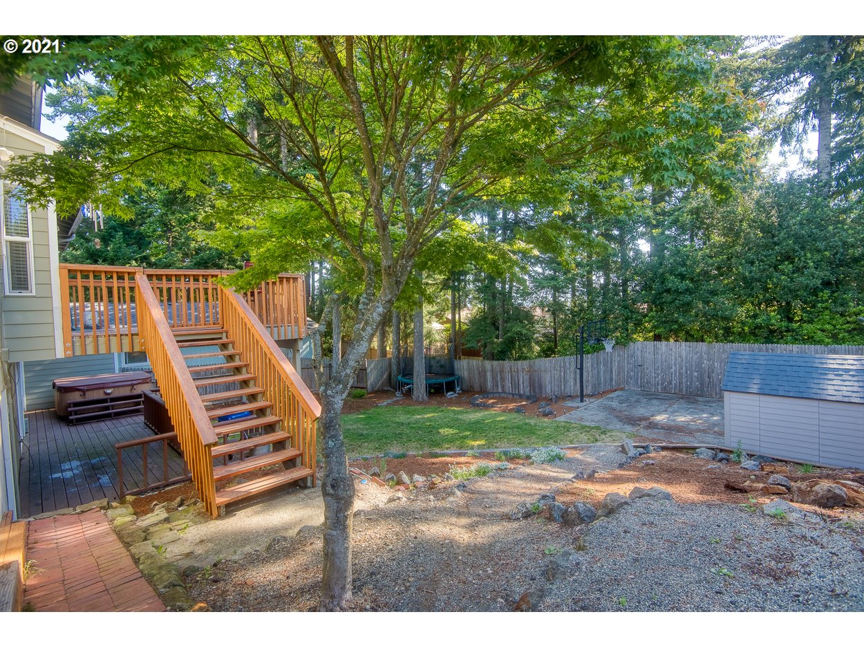 1845 Oak Street North Bend, OR 97459 - Photo 27 of 31 a view of a chairs and table in patio with wooden floor