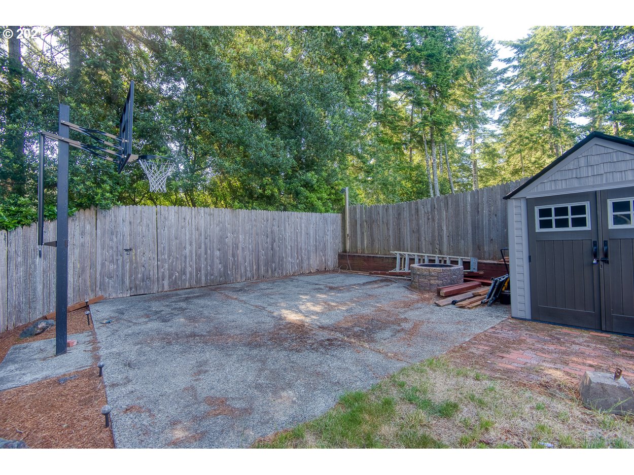 1845 Oak Street North Bend, OR 97459 - Photo 28 of 31 a view of a backyard with a garden