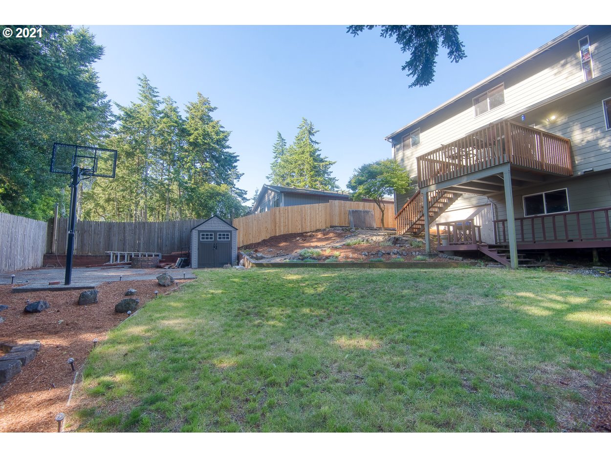 1845 Oak Street North Bend, OR 97459 - Photo 30 of 31 a view of a backyard with a swing