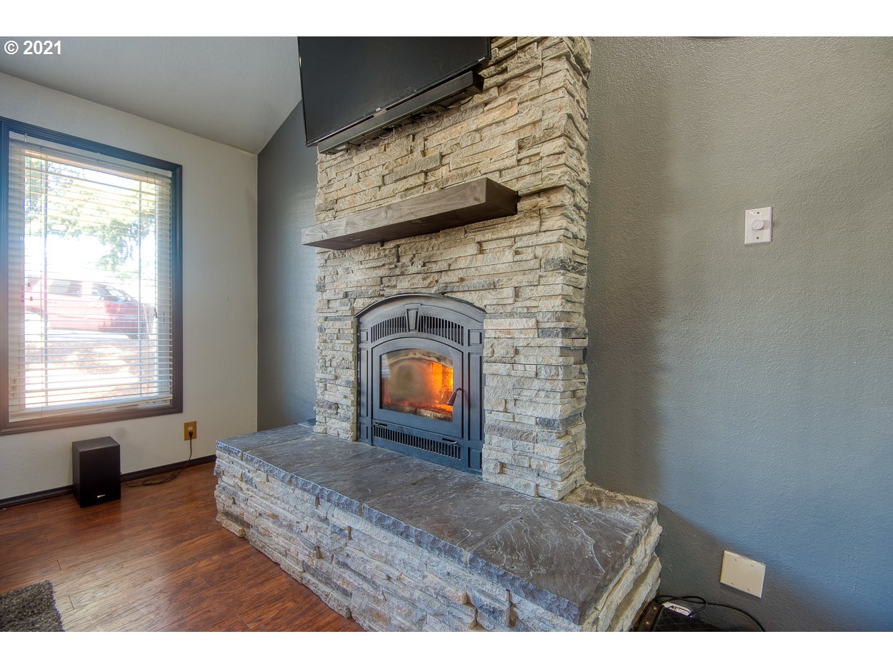 1845 Oak Street North Bend, OR 97459 - Photo 7 of 31 a living room with furniture and a fireplace