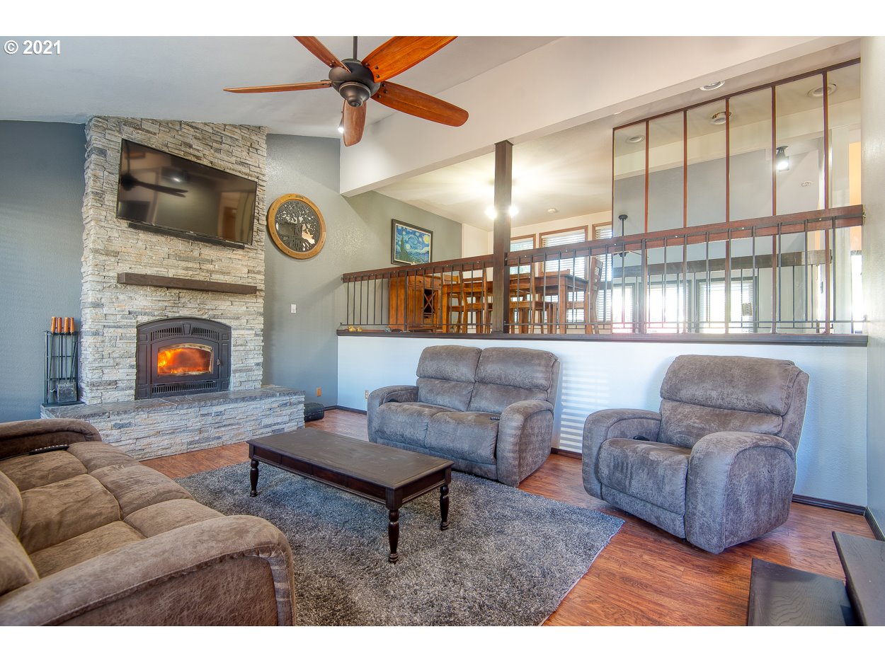 1845 Oak Street North Bend, OR 97459 - Photo 8 of 31 a living room with furniture and a fireplace