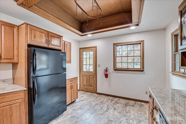 a view of a room with wooden floor and fan