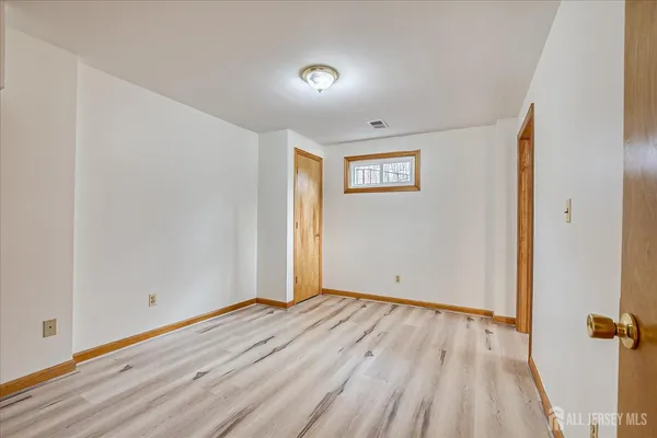 a view of a livingroom with furniture and a flat screen tv