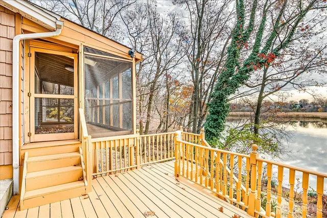 a view of a house with a yard covered in snow