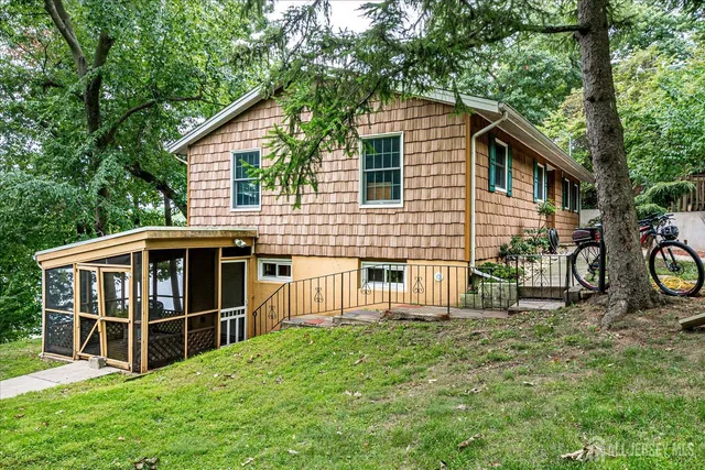 a bedroom with bed and a window