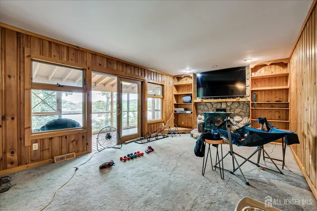 a bedroom with bed and a window