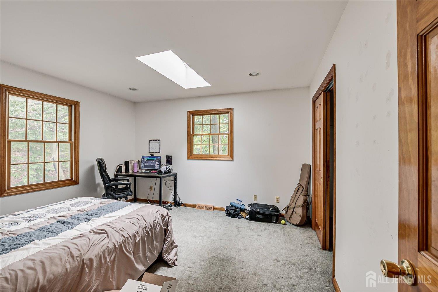 23 Cardownie Street Edison, NJ 08817 - Photo 47 of 65 a bedroom with a bed and a large window