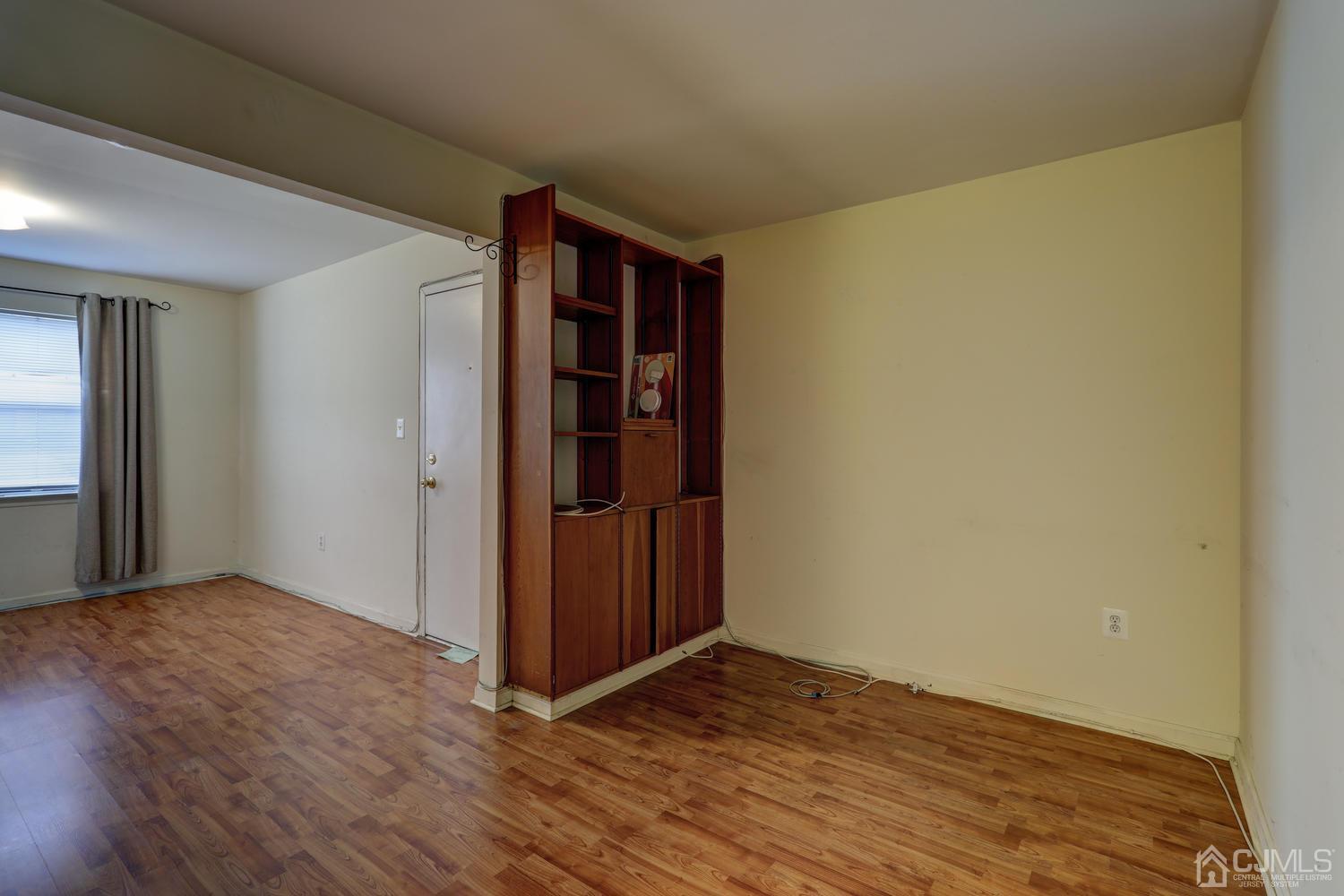 1914 Raspberry Court Edison, NJ 08817 - Photo 7 of 26 an empty room with wooden floor and closet