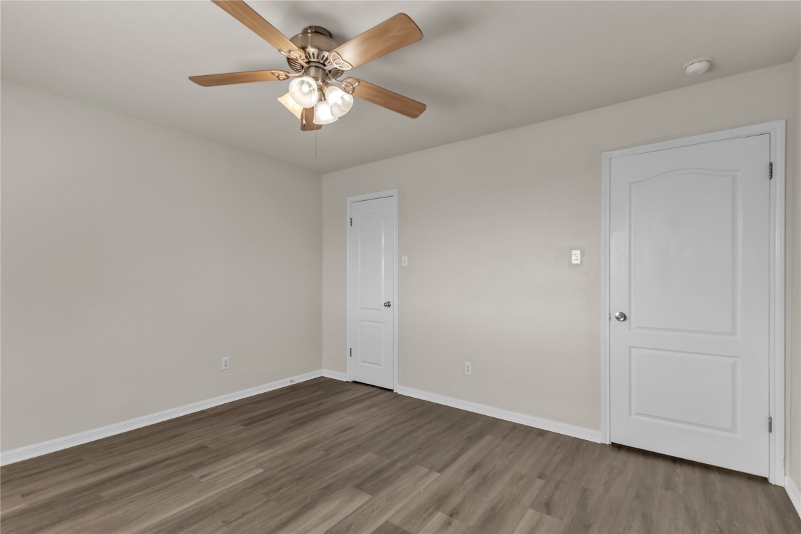 3733 Eagles Nest Street Round Rock, TX 78665 - Photo 14 of 19 a view of a room with wooden floor and a ceiling fan